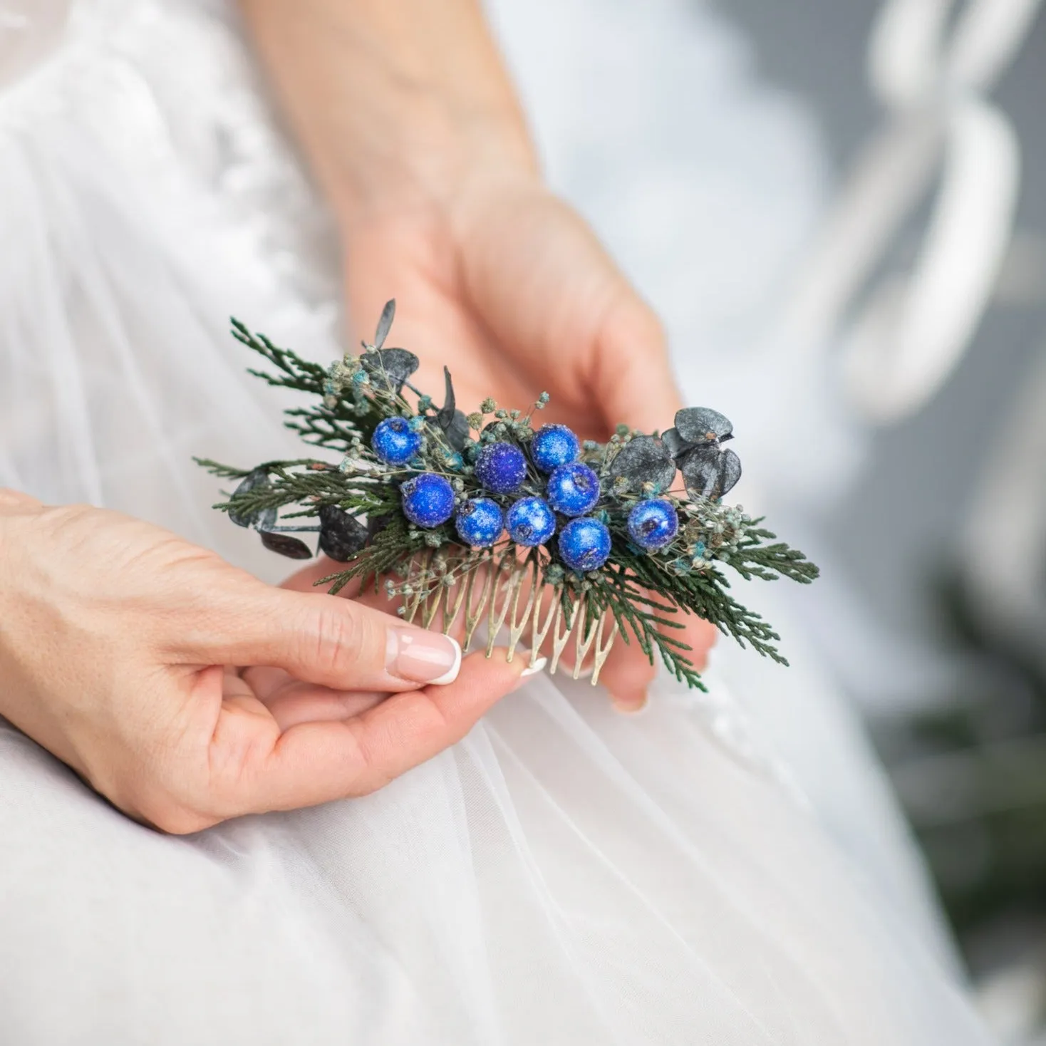 Blue winter hair comb with frozen berries