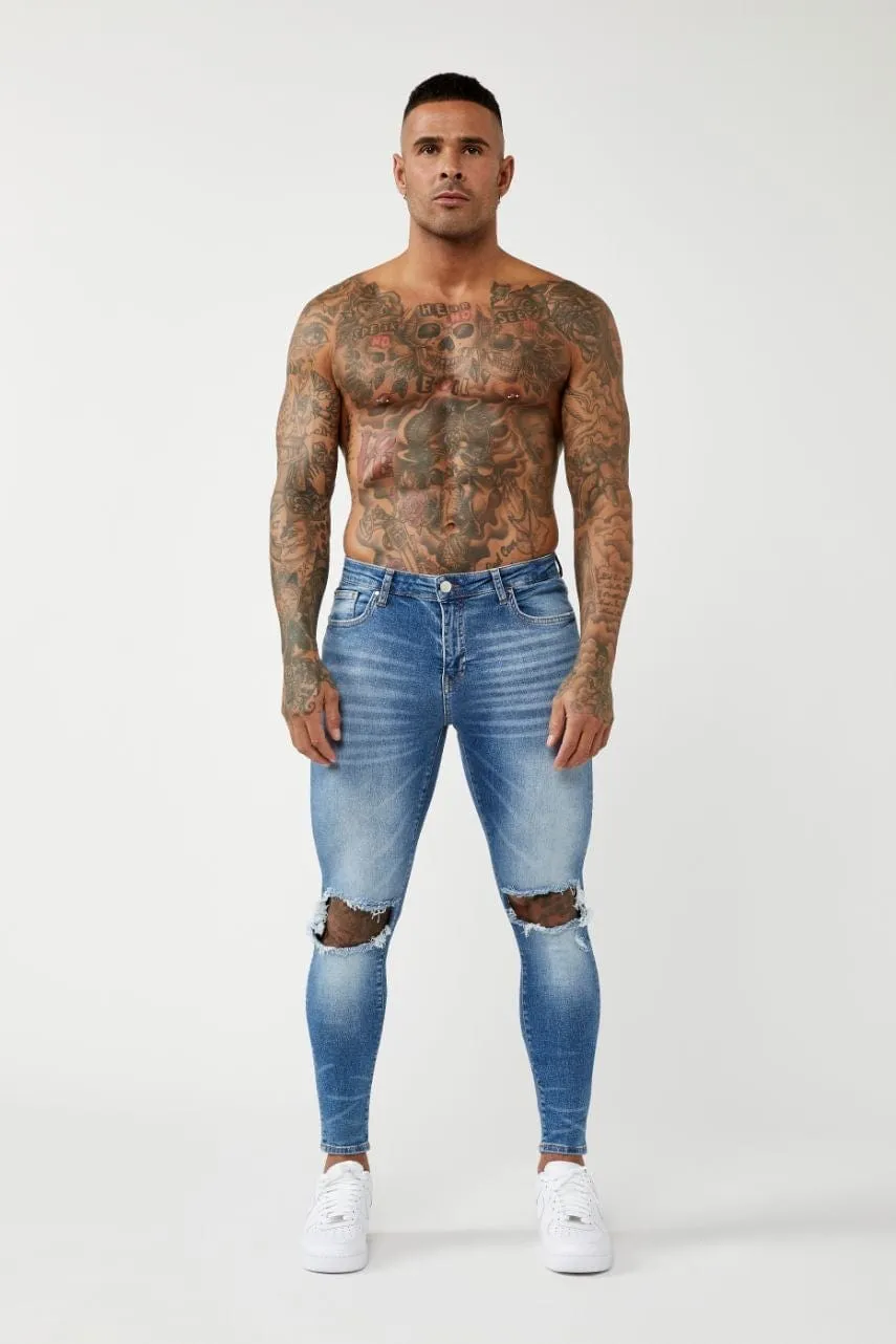 PREMIUM SKINNY FIT JEANS DESTROYED KNEE - MID BLUE WASH